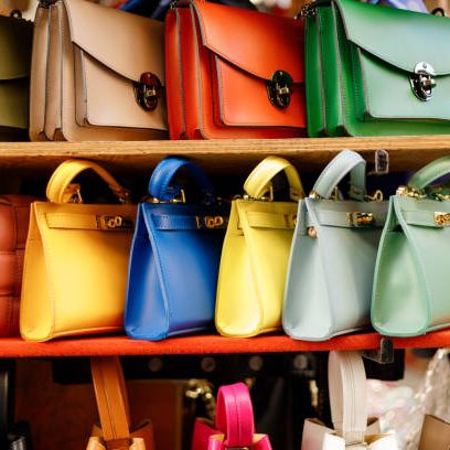Close up of different leather bags on market